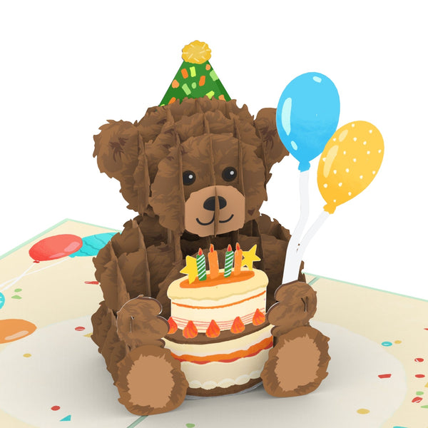 Teddy con una carta pop-up di torta di compleanno